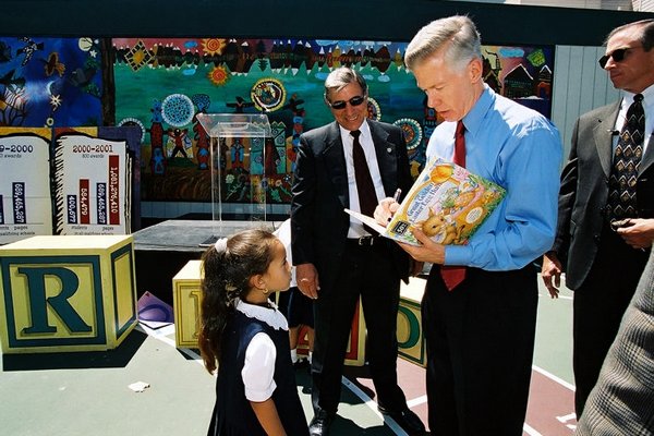 Governor Davis Is Presented With a Book From a Young Girl Following a Southern California School Event to Highlight Improving Academic Scores.