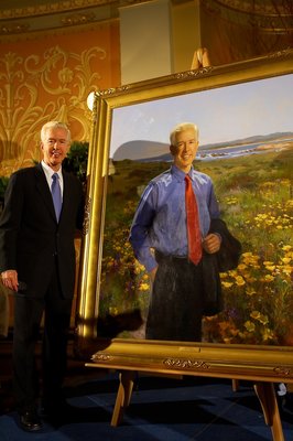 Governor Davis Standing Next to His Official Portrait.