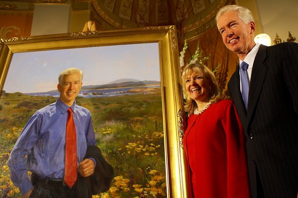 Governor Davis and First Lady Sharon Davis Stand Next to His Official Portrait.