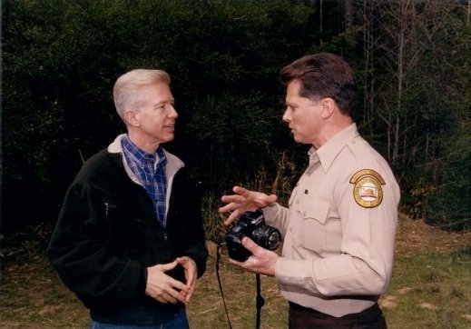 Governor Gray Davis talking with a State Park ranger about environmental issues.  