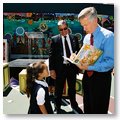 Governor Davis Is Presented With a Book From a Young Girl Following a Southern California School Event to Highlight Improving Academic Scores.