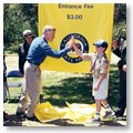 Governor Gray Davis giving a young boy a hi-five at a California State Park Event.