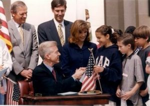 Gray davis shaking hands with kids